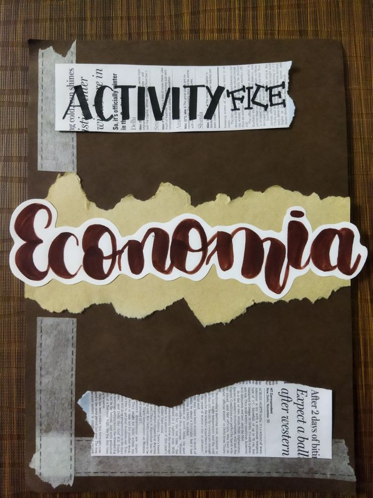 a piece of paper with the word econ on it and some torn up papers