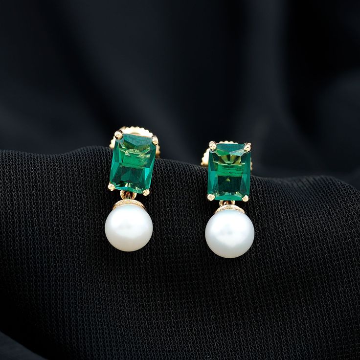 Product Details Make a statement with these stunning Octagon Cut Created Emerald earrings, set in a Prong Setting and paired with elegant Freshwater Pearl Drops. Crafted from high-quality gold, these Pearl earrings are a perfect blend of classic elegance and modern design, making them an ideal accessory for any occasion. Product Information SKU SHP-EARRINGS082210232 Weight 1.15 gm (Approximate) FRESHWATER PEARL INFORMATION No.of Stones 2 Pieces Total Weight 4.47 Carat (Approximate) Dimension(app Pearl Emerald Earrings, Freshwater Pearl Drop Earrings, Lab Created Emerald, Emerald Earrings, Pearl Drop Earrings, Pearl Drop, Classic Elegance, Earrings Set, Prong Setting