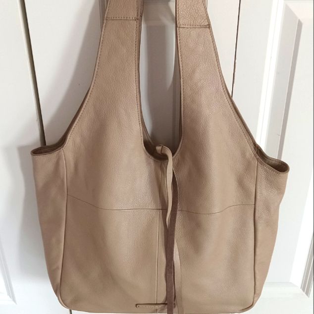 Totally On Trend, The Rhyn Hobo Bag From Lucky Brand Has Enough Room For All Your Essentials Plus You'll Look Like A Million Bucks When You Carry It! Details: Ultrasoft Leather In Light Camel Tan (Did I Mention It's Ultrasoft!?) Magnetic Snap Closure One Shoulder Strap With 13" Drop Exterior Pockets: 1 Slip Interior Pockets: 1 Zip, 1 Slip Fabric Lining Measures 13½" L X 5" W X 12" H Brand New With Tag Chic Hobo Bag With Leather Backing For Daily Use, Beige Textured Leather Hobo Bag For Shopping, Chic Leather-backed Hobo Tote Bag, Chic Rectangular Hobo Bag With Leather Backing, Rectangular Textured Leather Hobo Bag For Shopping, Rectangular Beige Textured Leather Hobo Bag, Textured Leather Tote Hobo Bag For Shopping, Rectangular Hobo Bag With Leather Lining For Shopping, Beige Leather Hobo Shoulder Bag