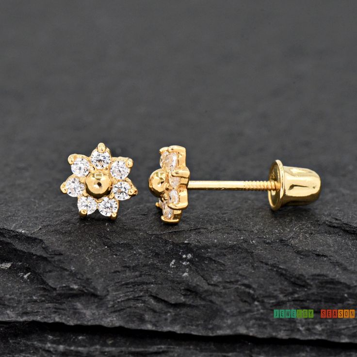 14K Gold Dainty Delicate Seven Petal Round CZ Flower Studs Screw Back Earring Girls Womens Children's Gift *Note: This listing is for One Pair of Stud earrings Metal: Solid 14K Yellow Gold Metal Stamp: 14K Finish: Polished Size: 4.3mm Stone Size: 1.5mm Gem Type: High-Quality Grade AAA CZ (Cubic Zirconia) Gem Shape: Round Gem Color: Clear CZ Setting: Casting Prong Setting Backing: Screw Back/ Safety Back *Nickel FREE* Perfect for Toddler, Baby, Babies, Kids, Children, Girls, Teens, Womens Perfect Flower Earring, Earrings Metal, Childrens Gifts, Everyday Earrings, Flower Studs, Girls Earrings, Screw Back Earrings, Metal Stamping