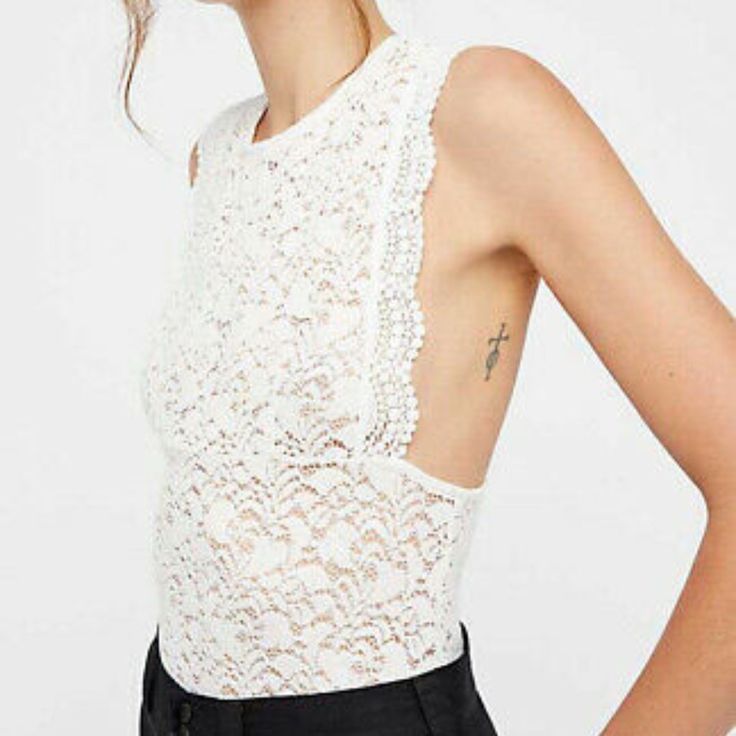 Size S New With Tags A Lacy Tank Is Simple Yet Chic To Throw On For An Effortless Look. Pair With Shorts And Sandals And Wear All Summer Long This Coming Season. Fit: This Style Fits True To Size. - Crew Neck - Sleeveless - Slips On Over Head - Racerback - Lace Construction - Unlined - Approx. 23" Length (Size S) - Imported Fiber Content 97% Nylon, 3% Spandex White Stretch Tank Top For Brunch, White Backless Top For Day Out, Spring Backless Lace Top, Backless Lace Tops For Spring, Lace Tank, Ivory White, Free People Tops, Lace Top, Tunic Tops