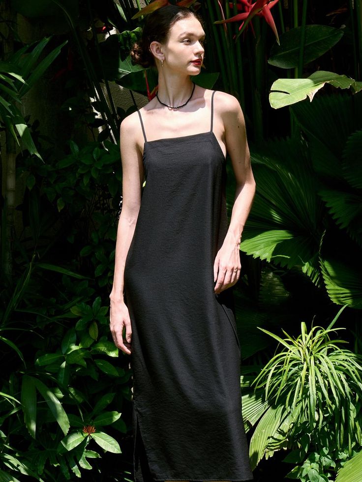 This is a modern and casual sleeveless dress by FACADE PATTERN that is made out of high quality and sturdy fabric. With unique design detail and trendy mood, you can style it for your clean and casual daily outfit.- Adjustable string on the back- Light and cool touch of fabric- Maxi length and sleeveless design Longline Summer Midi Dress With Side Slits, Summer Longline Midi Dress With Side Slits, Longline Summer Dress For Date Night, Sleeveless Midi Dress With Side Slits, Black Longline Maxi Dress For Summer, Chic Longline Midi Dress For Summer, Chic Black Slip Dress With Side Slits, Sleek Maxi Dress With Spaghetti Straps For Spring, Chic Longline Summer Dress