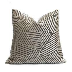 a black and white pillow on a white background