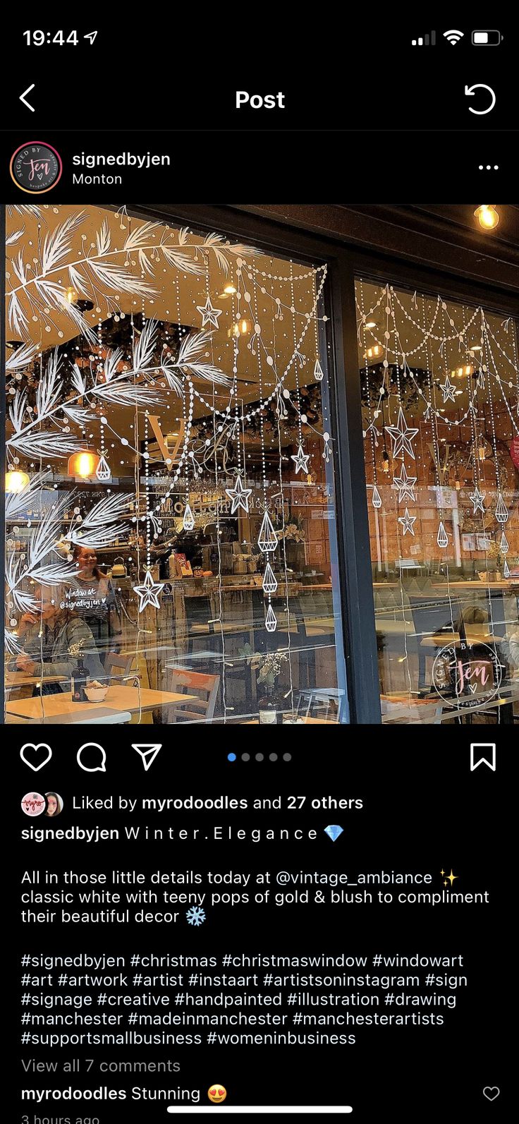 an image of a window that has been decorated with lights and snowflakes on it