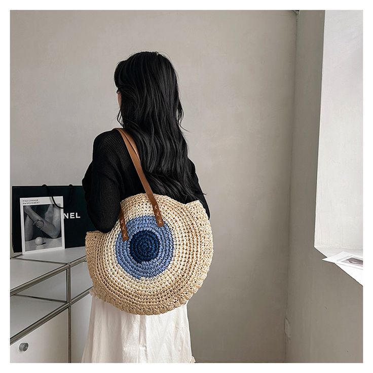 In stock fast shipping from Los Angeles! The Elena Handbags Boho Round Beach Straw Tote is the perfect accessory to elevate your summer style. Handcrafted with eco-friendly woven straw, this stunning boho shoulder bag is sure to make a statement whether you're beach-going, yoga-practicing or running everyday errands. Carry your essentials in style with this chic and sustainable tote. Size: 44cm in diameter (17in) Designer Style ID: 8465 Boho Round Beach Woven Bag, Handmade Straw Woven Shoulder B Blue Straw Tote Bag, Spring Bohemian Jute Bags, Blue Woven Straw Crochet Bag, Rectangular Blue Straw Bag, Bohemian Straw Travel Bags, Bohemian Straw Bags For Travel, Bohemian Travel Bags Made Of Straw, Bohemian Jute Beach Bag For Vacation, Blue Straw Crochet Tote Bag