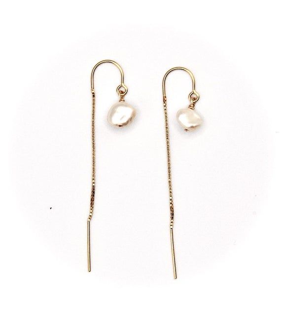 These gorgeous Keshi pearl thread earrings are timeless and classy. They shimmer in the light and match any outfit, about the size of a pea.Available with 14k gold fill ear threads or sterling silver*14K Gold filled metal is highly superior to "gold plated" as it is non-tarnish, can be worn in water, and is hypoallergenic.Want it with regular earwire? Just ask! Yellow Gold Threader Earrings With Pearl Drop, Yellow Gold Long Drop Threader Earrings With Pearl Drop, Gold Threader Earrings With Pearl Drop For Formal Occasions, Formal Gold Threader Earrings With Pearl Drop, Minimalist Pearl Chain Drop Threader Earrings, Minimalist Pearl Chain Threader Drop Earrings, Gold Teardrop Threader Earrings With Pearl Drop, Minimalist Gold Pearl Threader Earrings, Elegant Gold Threader Earrings With Pearl Charm