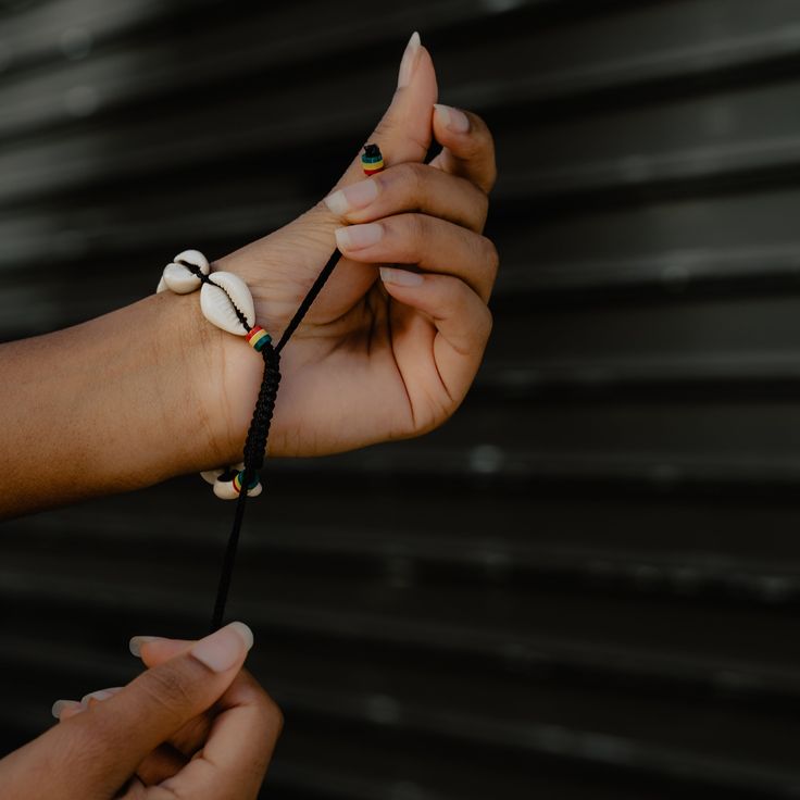 Our Ozo Cowrie Shell Bracelets are the perfect accessory to add a fun, yet meaningful touch to any outfit. Handmade with genuine cowrie shells from the coast of Senegal, each bracelet is expertly crafted by Senegalese artisans. Cowrie shells are a symbol of wealth, prosperity and fertility in any African cultures. It is said that cowrie shells bring good luck and to protect the spirit of the wearer. Shell Bracelet, Cowrie Shell, African Culture, Fertility, Shells