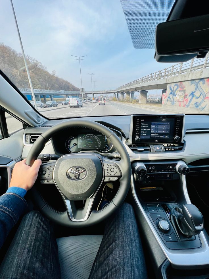 a person driving a car on a highway