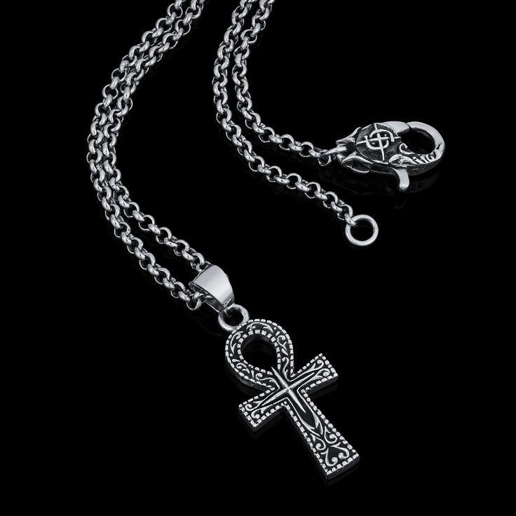 The Ankh symbol or “Key of Life”, is an Ancient Egyptian symbol that represents eternal life. Handcrafted from solid silver its unique design is also associated with protection and good fortune to those who possess it. Handcrafted Sterling Silver pendant and clasp. Comes on a 55cm x 2.5mm gauge stainless-steel cable-chain. Symbolic Metal Cross Necklace, Symbolic White Gold Cross Pendant Jewelry, Spiritual Stainless Steel Cross Pendant Necklaces, Symbolic Stainless Steel Cross Necklace, Symbolic Engraved Jewelry For Blessing, Spiritual Ankh Necklace Hallmarked, Symbolic Engraved Ankh Jewelry, Symbolic Stainless Steel Cross Pendant Necklace, Symbolic White Gold Stainless Steel Jewelry