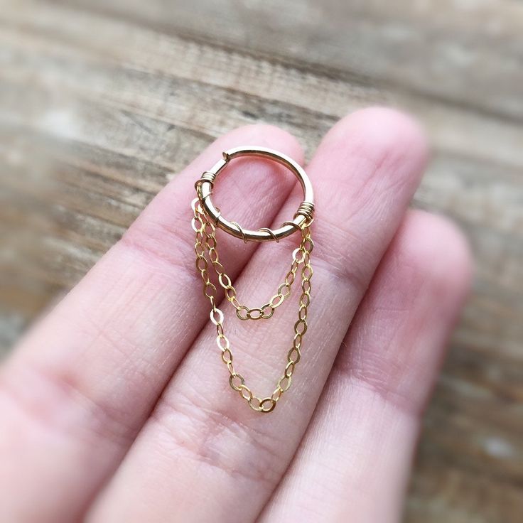 ♥Simply♥Dainty♥Everyday♥Minimal♥ 14k gold filled 14k rose gold filled 925 sterling silver hoop and chain Inner diameter: 9/10/11/12mm 16 gauge/1.2mm 18 gauge/1.0mm 20gauge/0.8mm 22gauge /0.64mm 24gauge/0.5mm ---------------------------------------------------------- Earrings are priced individually. 14k gold filled Anyone who can wear gold can wear gold filled without worries of any allergic reaction to the jewelry. Gold filled jewelry is an economical alternative to solid gold! ---------------- 14k Gold Hoop Jewelry With Adjustable Chain, Tarnish Resistant 14k Gold Filled Cartilage Earrings For Gift, Tarnish Resistant Silver Cartilage Earrings In 14k Gold Filled, Hypoallergenic 14k Gold-filled Silver Cartilage Earrings, Dainty Tarnish-resistant Huggie Jewelry, Dainty Nickel Free Yellow Gold Jewelry, Dainty Gold Hypoallergenic Cartilage Earrings, Dainty Hypoallergenic Gold Cartilage Earrings, Tiny Huggie Fine Jewelry