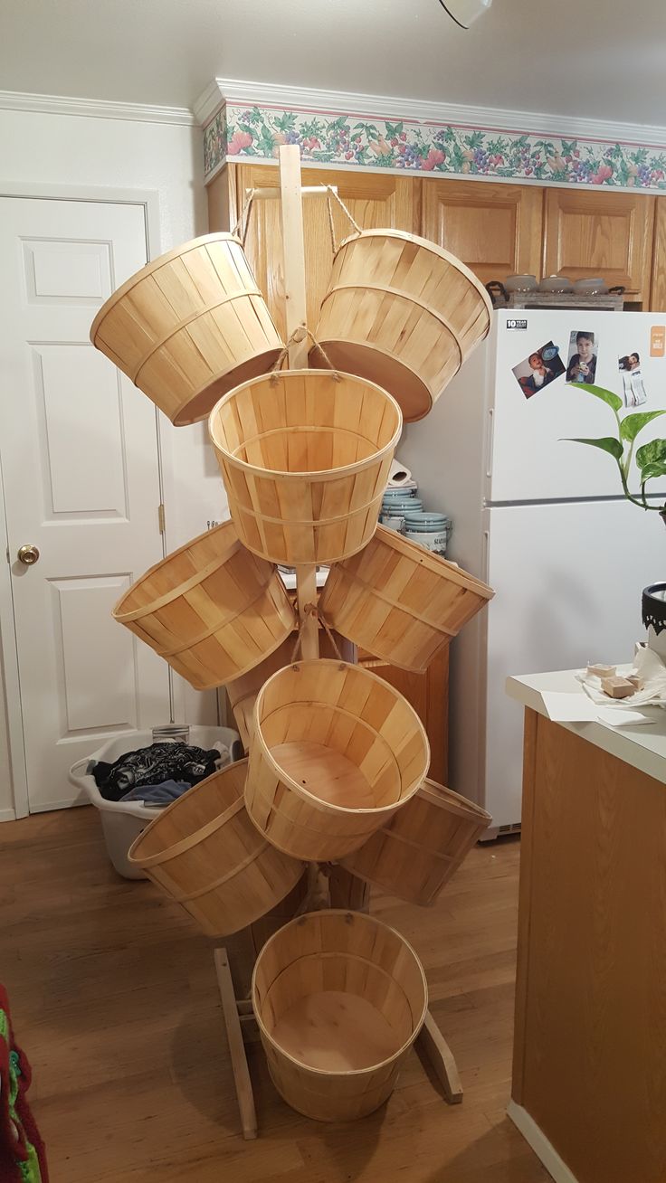 a stack of baskets sitting on top of a wooden table