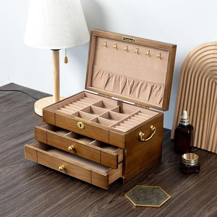 This elegant Wooden Jewelry Box is a spacious organizer designed to store and protect your precious jewelry. Featuring a secure lock, it ensures your items stay safe, while its compartments provide ample space for rings, necklaces, bracelets, and more. The timeless design makes it a thoughtful gift for women and girls, perfect for weddings, anniversaries, or special occasions like Mother's Day. Personalize it for an extra special touch, making it not just a storage solution, but a cherished keep Jewelry Box Organizer, Luxury Jewelry Box, Necklace Storage, Wooden Jewelry Box, Wooden Accessories, Box Organizer, Wood Accessories, Wood Jewelry Box, Jewelry Organizer Box