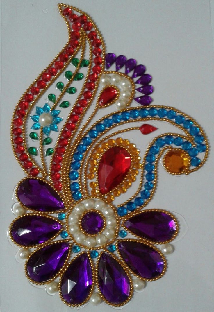 a colorful brooch with lots of beads on it