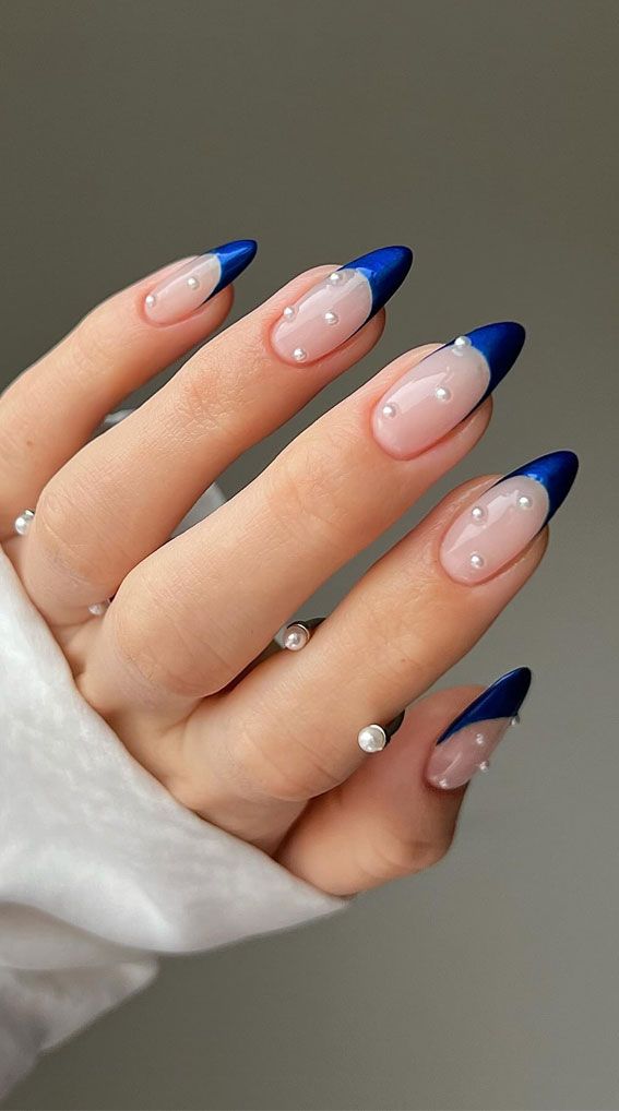 blue french tips with pearls, blue nails, butterfly blue nails, blue nail designs, blue nail art, blue nail ideas, mismatched blue nails, short blue nails, simple blue nails, almond blue nails Navy Blue Nails Homecoming, French Nail Art Blue, Trendy Dark Blue Nails, Almond Nails Designs Navy Blue, Nail Art Designs Blue French Tips, Navy Blue Nails With Pearls, Blue Nail Designs French Tips, Navy Pearl Nails, Elegant Blue Nails Classy