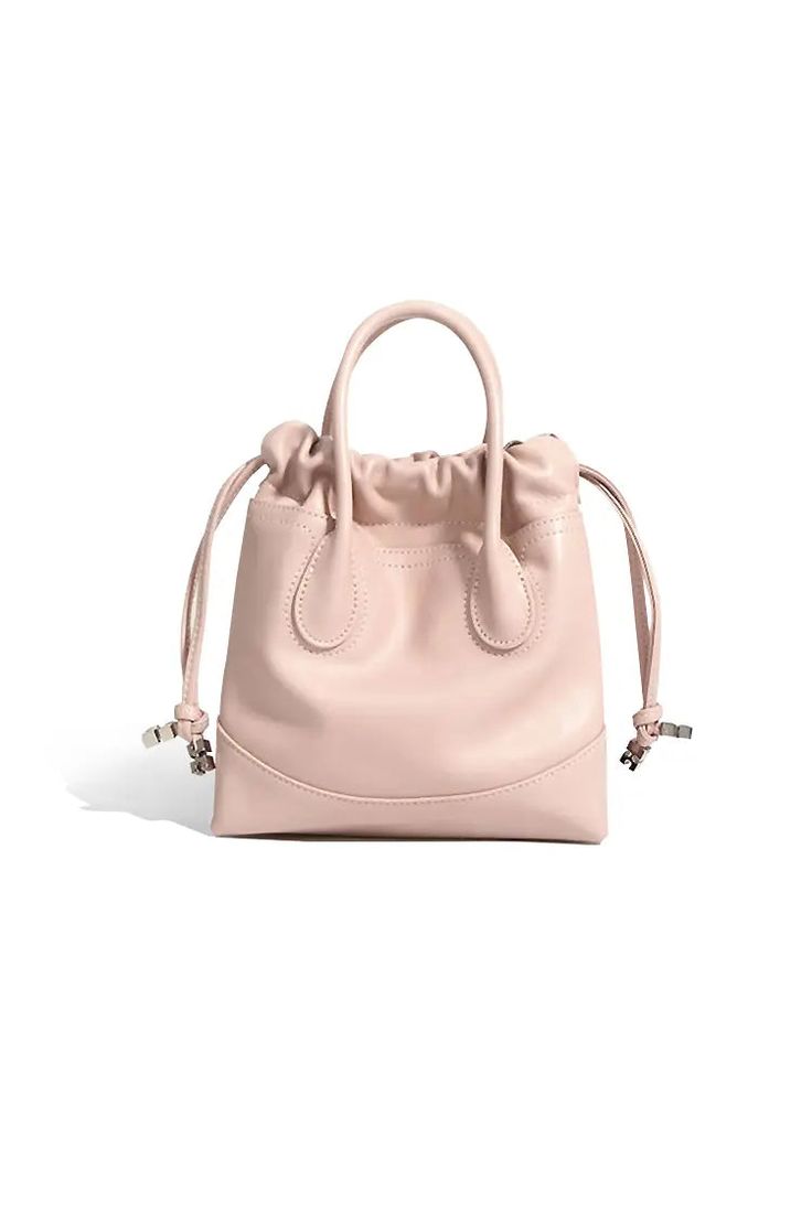 Perfectly Crafted Leather Mini Tote for Every Occasion Introducing our 2024 Leather Mini Tote Bag, crafted from premium calfskin in a soft pink hue. This stylish bag features sturdy top handles and an adjustable shoulder strap, offering versatile carrying options. The unique drawstring design enhances security while adding a playful touch. Perfect for daily commutes and casual outings. Style #: WWAJ804 Pink Top Handle Bucket Bag, Pink Everyday Bucket Bag With Top Carry Handle, Everyday Pink Bucket Bag With Top Handle, Pink Leather Rectangular Bucket Bag, Pink Rectangular Leather Bucket Bag, Rectangular Pink Leather Bucket Bag, Pink Top Handle Bucket Bag With Removable Pouch, Leather Satchel With Handles, Pink Shoulder Bucket Bag With Top Handle