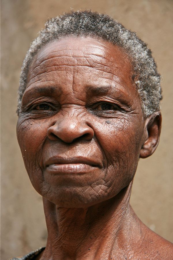 an older woman with wrinkles on her face and the image is split in half