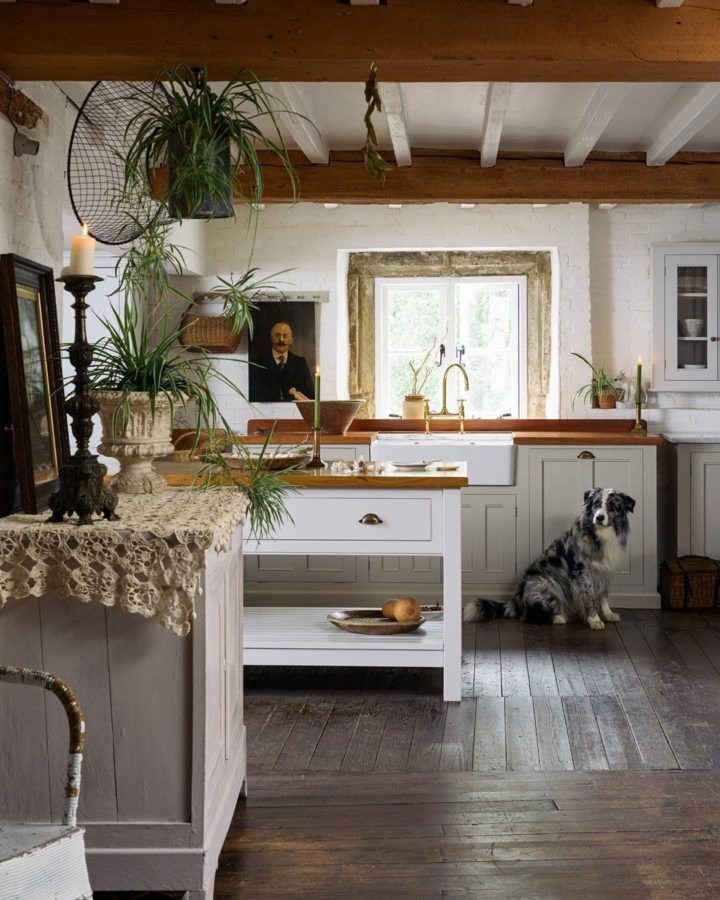 the instagram page shows an image of a kitchen with white cabinets and wood floors