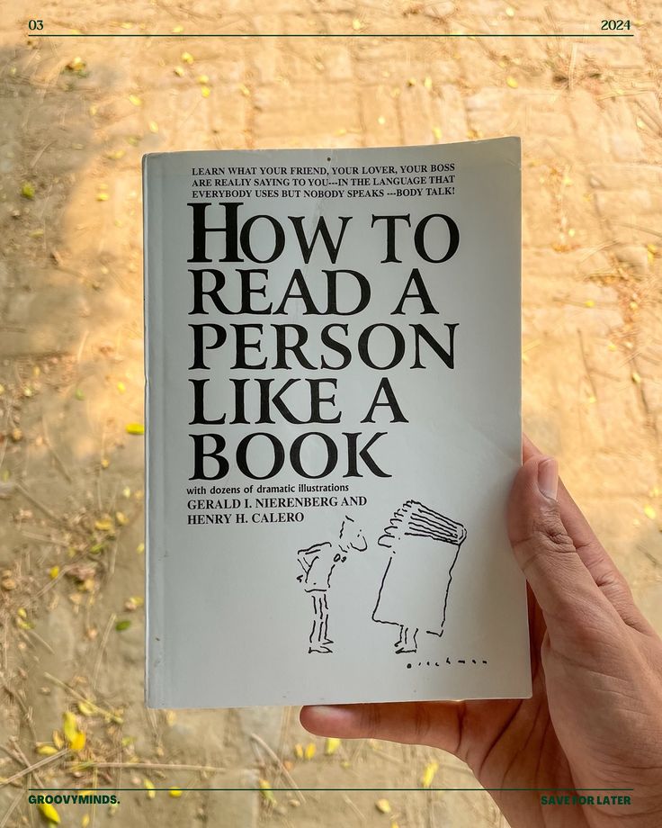 a person holding up a book with the title how to read a person like a book