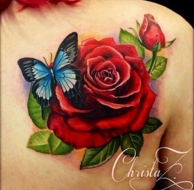 a woman with a rose and butterfly tattoo on her back