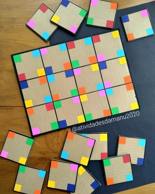 several pieces of cardboard with colored squares on them