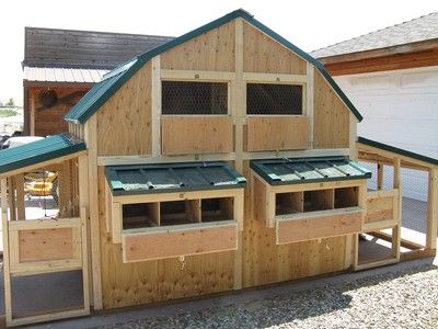 a wooden building with several windows on the roof