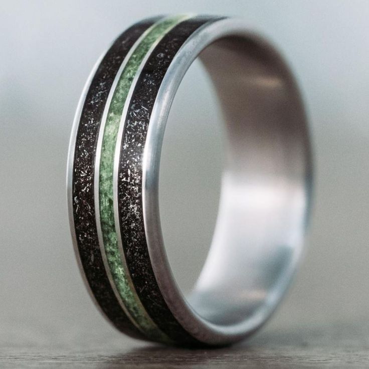 Interstellar-meteorite-dust-imperial-diopside-titanium-mens-wedding-band Men’s Wedding Bands Meteorite, Groom Ring Design, Titanium Mens Wedding Band, Wedding Band For Him, Pretty Engagement Rings, Bands Rings, 10k Gold Ring, Engraving Fonts, Titanium Wedding Rings