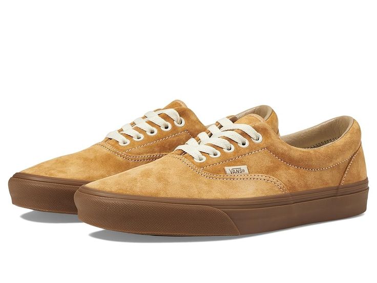 Vans Era - Skate Shoes : Pig Suede Gum Antelope : The Vans Era skate shoes keep your style going strong with clean and uncomplicated style, with more padding than the classic Authentic. Skateboard shoes with a low-top silhouette. Uppers of canvas, leather, or man-made materials with a double-stitched vamp. Cotton drill lining for breathable wear. Padded collar for added support. Die-cut EVA insert for reliable comfort. Vulcanized sole attachment with iconic waffle outsole for grippy wear and boardfeel. Imported. Measurements: Weight: 15 oz Product measurements were taken using size Men's 9, Women's 10.5, width Medium. Please note that measurements may vary by size. Vans Low-top Skate Shoes With Rubber Toe Cap, Casual Suede Skate Shoes With Rubber Sole, Streetwear Skate Shoes With Gum Sole, Suede Skate Shoes With Rubber Sole For Streetwear, Suede Skate Shoes With Speckled Midsole And White Sole, Suede Skate Shoes With Gum Sole And Round Toe, Brown Sneakers With Gum Sole For Skateboarding, Brown Suede Skate Shoes With Gum Sole, Vans Leather Sneakers With Vulcanized Sole