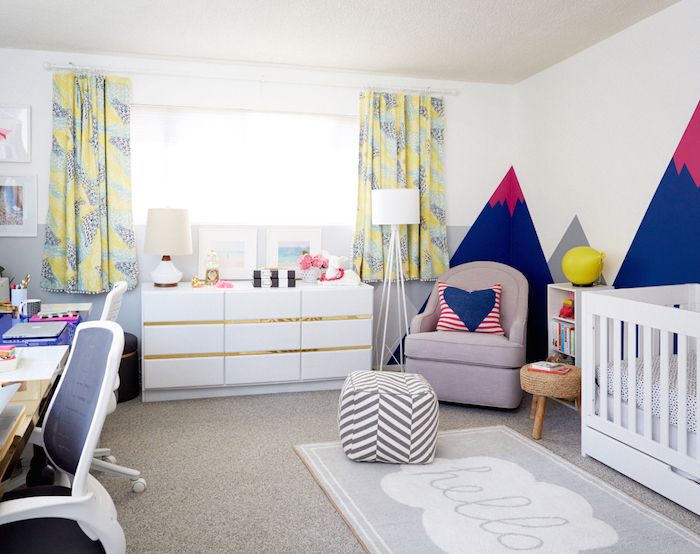 a baby's room with colorful walls and furniture