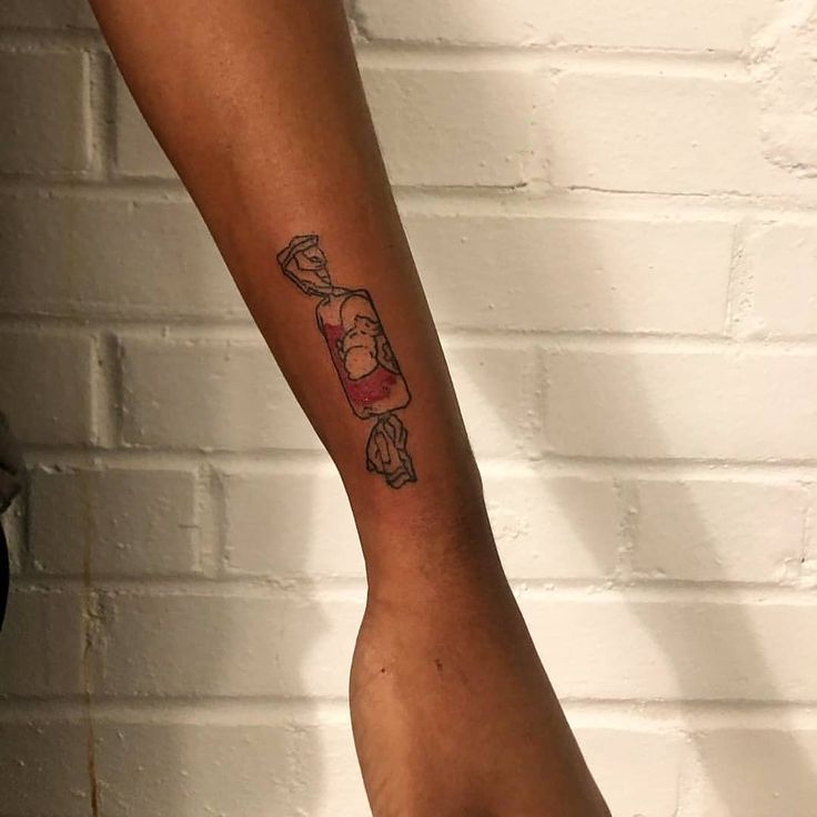 a person with a tattoo on their arm