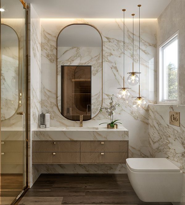 an elegant bathroom with marble walls and flooring