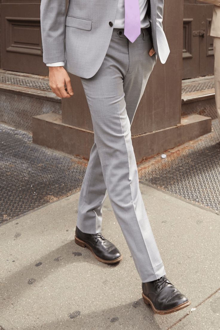 DESCRIPTION The Lite Grey Dress Pant is perfect for any wedding, special occasion or business engagement. Can also be used as an extra pair of pants for your Beige suit. We tirelessly evaluate thousands of fabrics before choosing the best in the industry. Our attention to detail is evident in luxury features like pick-stitching on the lapel and kissing buttons. We use the finest, most breathable, natural, 100% super fine 150’s Merino wool making the suit soft to the touch while remaining breatha Elegant Full Length Formal Suits, Formal Pants With Pressed Crease In Suiting Fabric, Formal Pants With Pressed Crease, Formal Slim Fit Pants In Suiting Fabric, Formal Slim Fit Suiting Fabric Pants, Formal Slim Fit Full-length Suits, Formal Full-length Suits With Pressed Crease, Professional Formal Straight Pants, Formal Custom Fit Pants With Welt Pockets