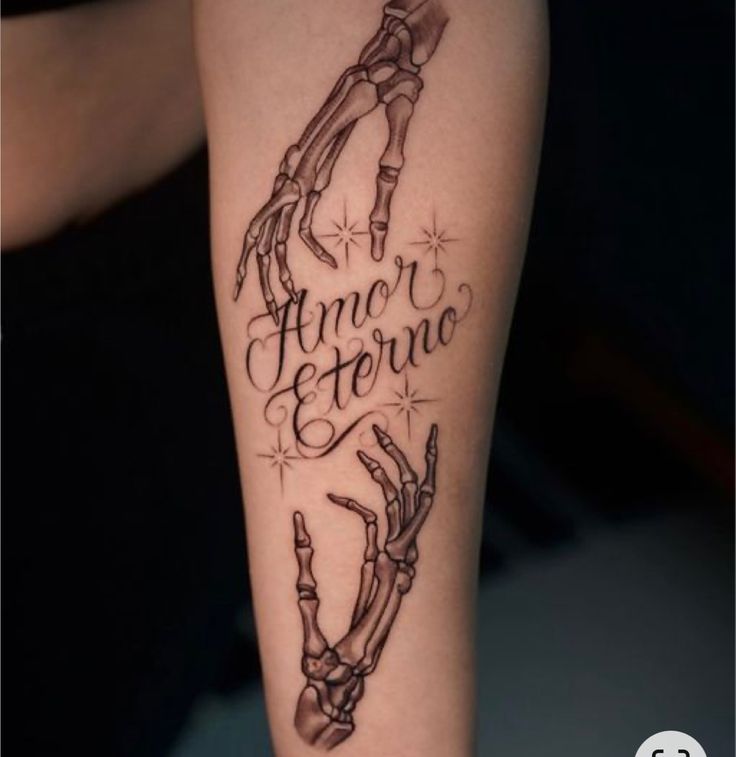 a tattoo on the arm that says armor and ferroe with two hands holding each other