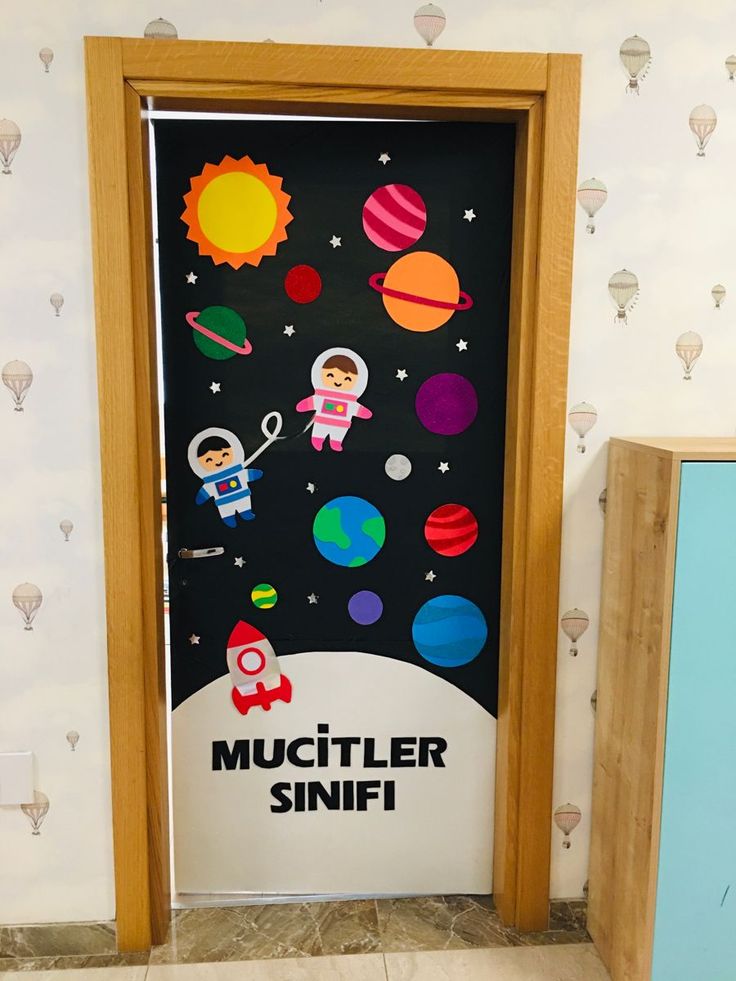 a door with an outer space theme painted on it and the words muffler sniff