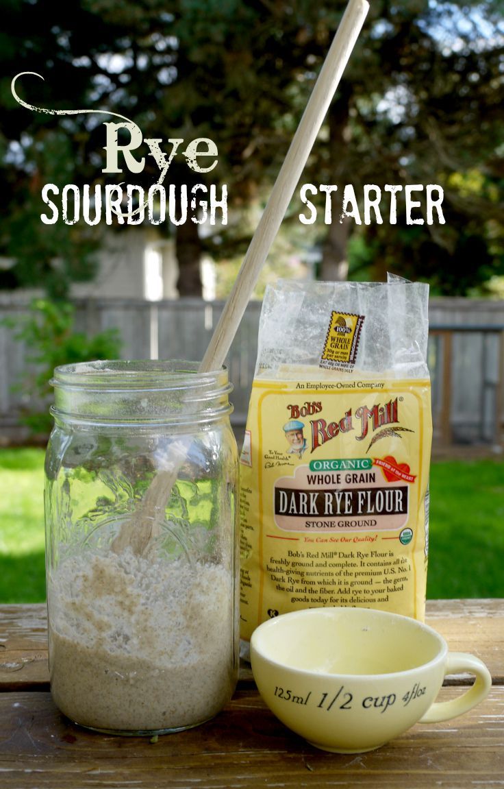 the ingredients to make sourdough sit on a picnic table with text overlay that reads rye sourdough starter