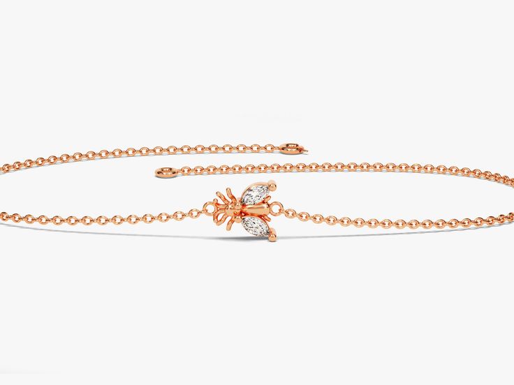 A luxurious addition to any ensemble, this Diamond Bee Bracelet in 14k Gold exudes glamour and sophistication. Featuring a 14k Gold setting and a shimmering Diamond Bee charm, this is the perfect piece for those with a taste for high-end fashion. Features• Made to Order• Gold Kt: 14K• Gold Color: Rose Gold, Yellow Gold, White Gold• Gem Stone: Natural White Diamonds• Diamond Cut: Marquise• Number of Stones: 2• Available Stone Sizes: 2 x 1.50 x 3.00 mm• Total CTW: 0.05 ct• Diamond Color - Clarity: Rose Gold Diamond Cut Bracelets, Rose Gold Diamond Chain Bracelet Fine Jewelry, Rose Gold Diamond Chain Bracelet, Rose Gold Diamond Cut Bracelet With Cubic Zirconia, Rose Gold Cubic Zirconia Bracelet With Diamond Cut, Rose Gold Cubic Zirconia Bracelets With Diamond Cut, Fine Jewelry Rose Gold Cubic Zirconia Chain Bracelet, Rose Gold Cubic Zirconia Chain Bracelet Fine Jewelry, Rose Gold Cubic Zirconia Chain Bracelet