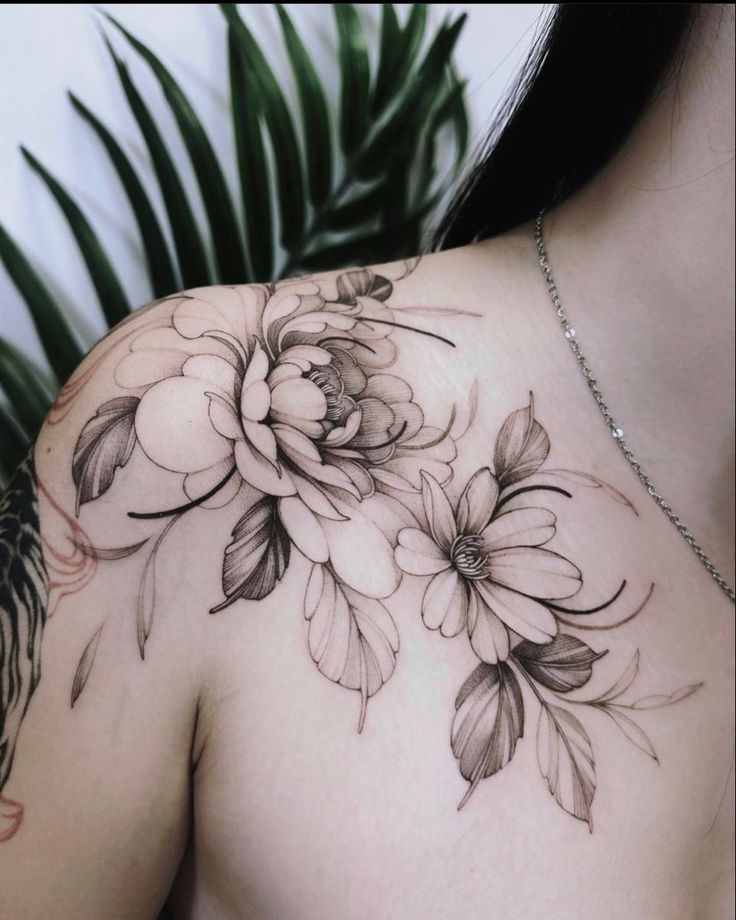 a woman's chest with flowers on it