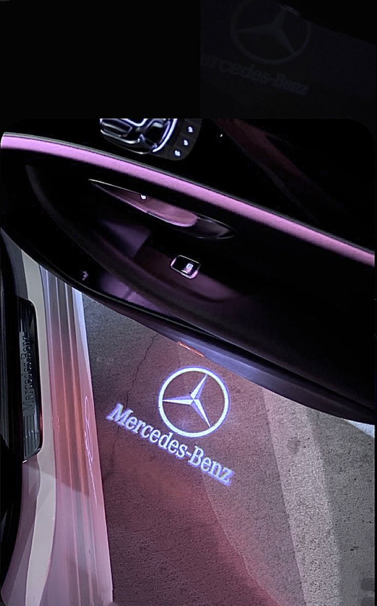 the mercedes benz logo is shown on the car door