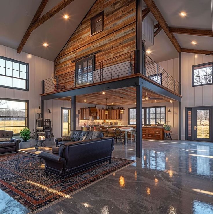 a large living room with high ceilings and wood paneling