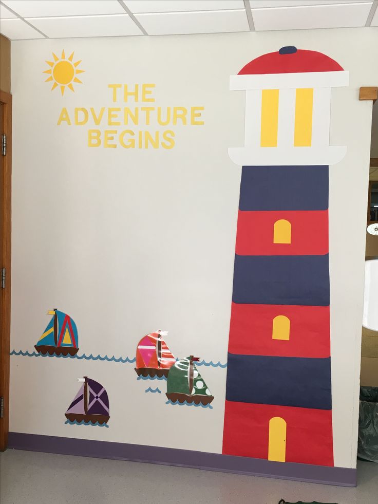 there is a sign that says the adventure begins with boats and lighthouses on it