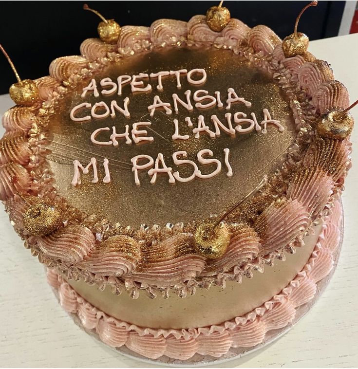 a cake with writing on it sitting on a table