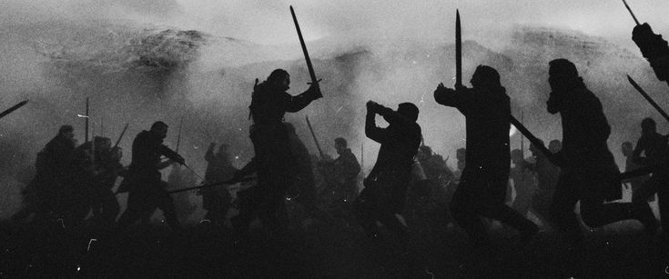 black and white photo of people with swords