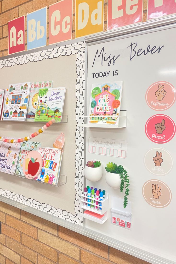 a bulletin board with many different types of magnets on it and some writing on the wall