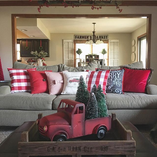 a living room filled with lots of furniture and christmas trees on top of a wooden tray