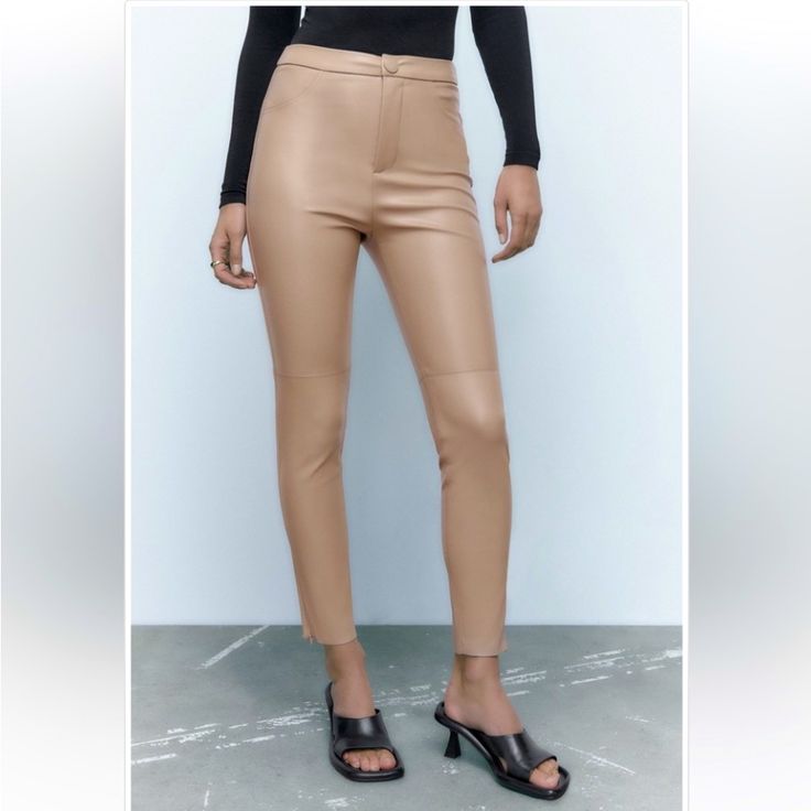 Blogger Fave! Zara Hi-Rise Faux Leather Leggings. High-Waisted. False Front Pockets. Front Zip And Snap Button Closure. Hidden In-Seam Zippers At Hem. Solid Cream Color. Base Fabric: Soft Fabric Inside. Color: Sand Material: 100% Polyester. Coating Material: 100% Polyurethane Approximate Measurements: 12“ Across The Waistband, 11“ Rise, 27“ Inseam Condition: Nwot Tags: Business Casual Casual Winter/Fall/Spring/Summer Fashion Outfit Contemporary Faux Leather Date Night Chic Faux Leather Bottoms For Spring, Fall Office Leggings, Elegant Office Leggings For Fall, Trendy Brown High-waisted Leggings, Trendy High-waisted Leather Pants For Spring, Casual Tight Faux Leather Pants, Chic Brown Leather Pants For Spring, Elegant Ankle-length Leggings For Fall, Chic Faux Leather Spring Pants