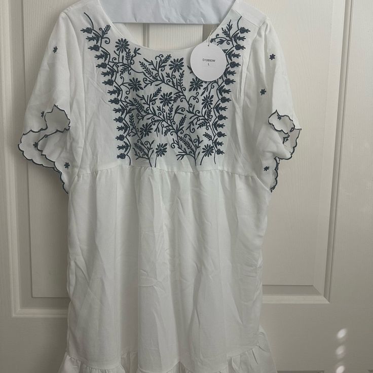 White Beach Dress Floral Embroidered V-neck Midi Dress For Vacation, Chic Short Sleeve Sundress For Beach Season, Chic Short Sleeve Beach Sundress, Short Sleeve Midi Dress For Summer Vacation, Vacation Midi Dress For Brunch, Brunch Vacation Midi Dress, Vacation Brunch Midi Dress, Breezy Short Sleeve Beach Dress For Day Out, Breezy Beach Dress With Short Sleeves