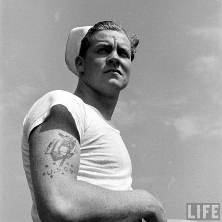 black and white photograph of a man with a sailor's hat on his head