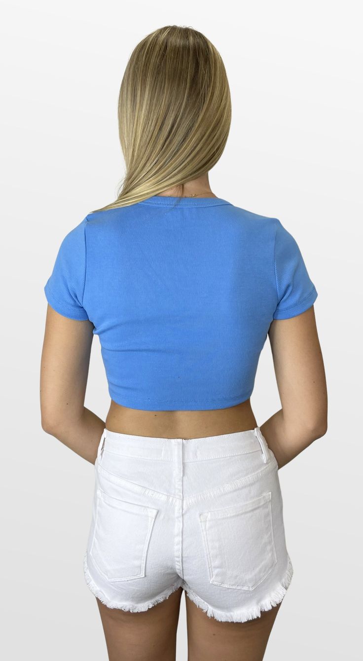 Perfect little tee - wear this one every day! A cute little ribbed knit cropped tee with a banded V-neckline and short sleeves is the perfect addition to your closet. Pair it with any bottoms for a comfortable and polished look. Color- Light Blue (Also Available in Orange, Royal, Green, Red, and Tan) 95% Polyester 5% Spandex Trendy V-neck Cropped T-shirt For Summer, Summer Cotton Cropped V-neck T-shirt, Trendy Fitted V-neck Crop Top, Spring Trendy V-neck Cropped T-shirt, Casual Fitted V-neck Cropped T-shirt, Trendy Short Sleeve Crop Top, Summer Ribbed Crop Top With Short Sleeves, Summer Cropped Ribbed T-shirt, Basic Ribbed Cropped T-shirt For Summer