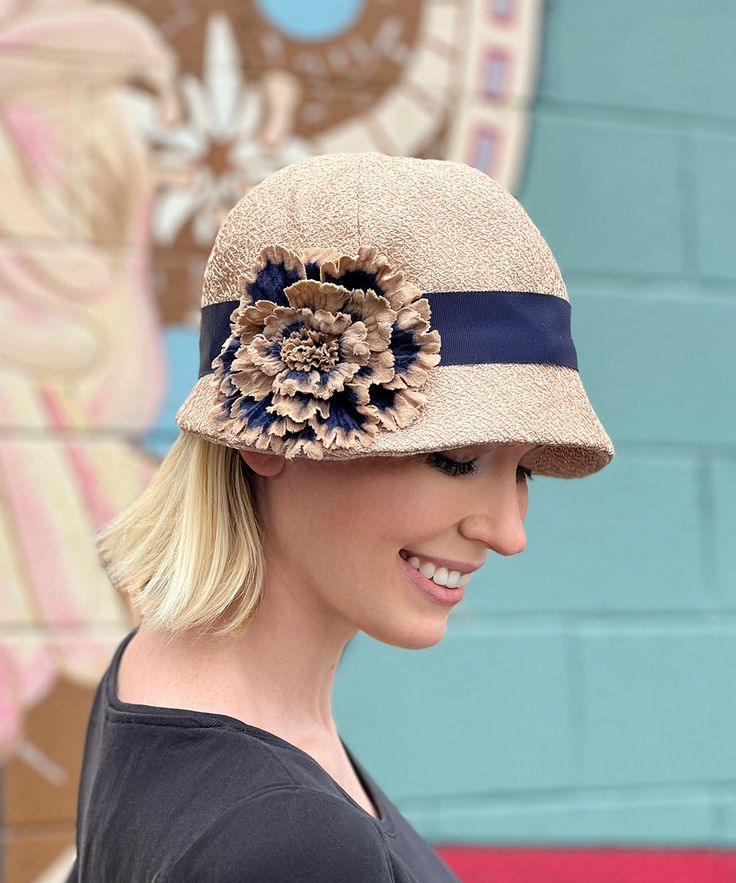 THE GRACE, handmade in Seattle, WA, USA, is a soft and flexible, 1920s style cloche hat. This hat is shown in Champagne Tumbleweed1 1/2" grosgrain band and assorted trims. The brim is 2" at center front, flaring out to 2 3/4" at side front, and curving back to 3/4" at center back of hat. The crown is made of six panels. Prices are as shown. These pieces are made-to-order and may be exchanged or returned for a store credit only. All sales of items with customizations or alterations are final. Ava Autumn Hat, Fancy Tea, Ruff Collar, Cloche Hats, 1920s Style, Cozy Coats, Fall Hats, Unique Hats, Designer Hats