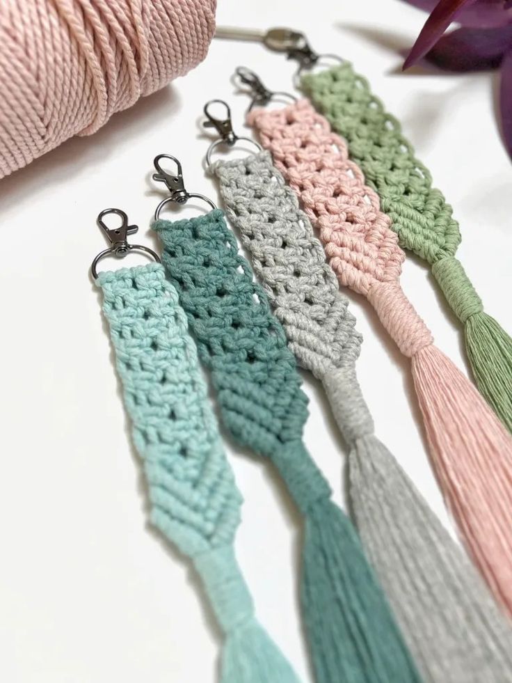 crochet tassels are lined up on a table