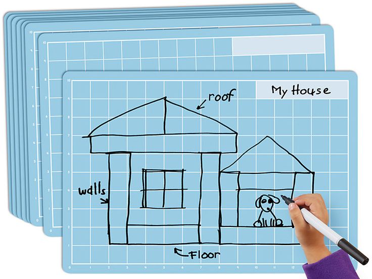 a child's hand drawing a house on a whiteboard